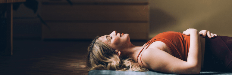 Woman Practicing Yoga, Relaxation Exercise in Serene Indoor Space