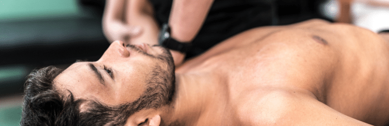 Athlete getting physical therapy (acupuncture treatment)