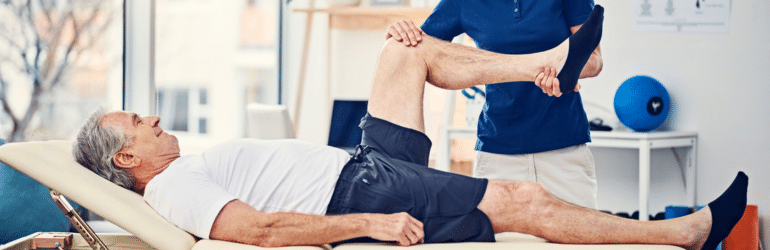 Female physiotherapist working with a senior male patient