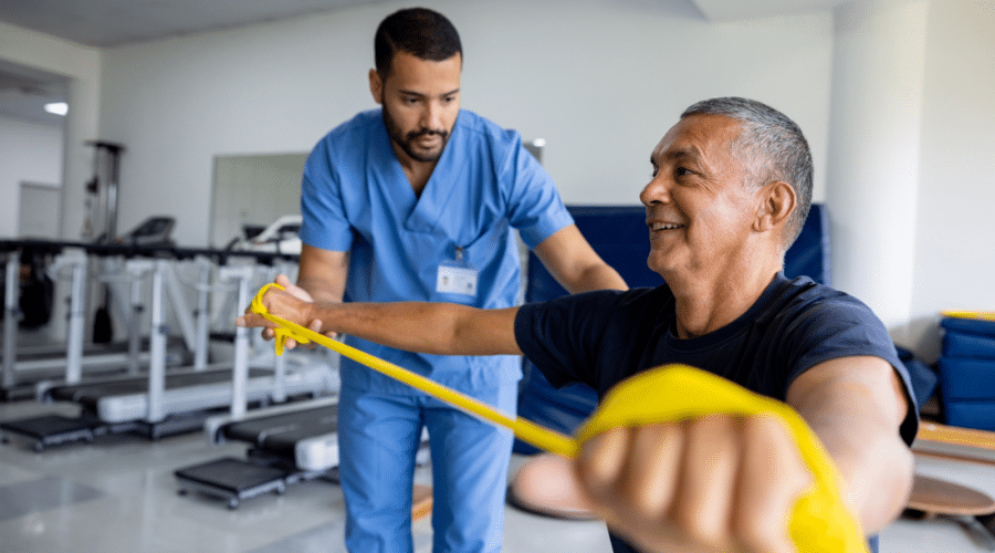 Man doing physical therapy exercises using a stretch band